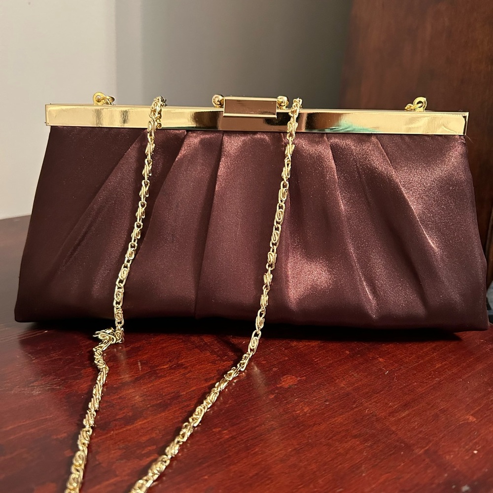 Brown silk clutch with gold tone shoulder strap